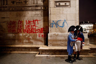 Graffiti is seen on the wall at the Arc de Triomphe the day after clashes with protesters wearing yellow vests, a symbol of a French drivers' protest against higher diesel taxes, in Paris