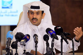 FILE PHOTO: Saad al-Kaabi, chief executive of Qatar Petroleum, gestures as he speaks to reporters in Doha
