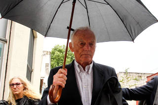 Former Ford Motor Co. executive Pedro Muller leaves the court after the trial in Buenos Aires