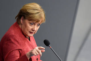 German Chancellor Angela Merkel addresses the lower house of parliament Bundestag in Berlin