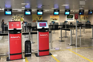 Empty check-in desk of Avianca airlines is seen at Afonso Pena International Airport in Sao Jose dos Pinhais