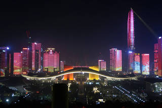 The central business area that lit up during a light show is seen ahead of the 40th anniversary of China's reform and opening up in Shenzhen