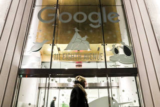 A pedestrian walks past Google headquarters in the Manhattan borough of New York City