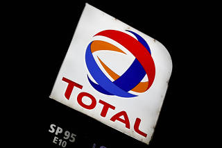 FILE PHOTO: The logo of French oil giant Total is pictured at a petrol station in Latresne near Bordeaux