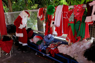 Richard Gamboa dresses up as Santa Claus during the event 