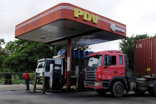 The corporate logo of the Venezuelan state-owned oil company PDVSA is seen at a gas station in Cupira