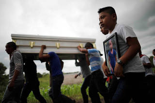 Friends and family carry a coffin with the remains of Jakelin Caal, a 7-year-old girl who handed herself in to U.S. border agents earlier this month and died after developing a high fever while in the custody of U.S. Customs and Border Protection