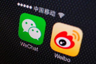 FILE PHOTO: Picture illustration shows icons of WeChat and Weibo apps