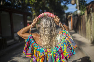 Maria Solange Ferrarini, who created a crocheted bikini, in Trancoso, a beach town in Bahia state, Brazil.