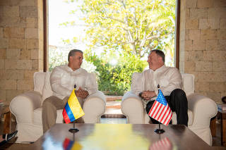 U.S. Secretary of State Mike Pompeo speaks with Colombian President Ivan Duque at the guesthouse in Cartagena
