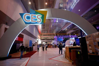 Workers prepare displays in the lobby of the Las Vegas Convention Center in preparation for 2019 CES in Las Vegas