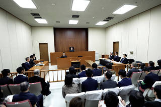 Judge Yuichi Tada sits in the presence of Motonari Otsuru, a chief lawyer of the legal team for ousted Nissan Motor Co. Chairman Carlos Ghosn, in a courtroom ahead of a court hearing for Ghosn's case at the Tokyo District Court in Tokyo
