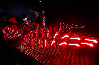 A display made of OLED tail lamps is shown in the Audi booth during the 2019 CES in Las Vegas