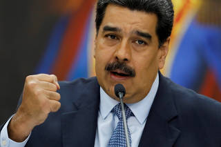 FILE PHOTO: Venezuela's President Nicolas Maduro gestures while he speaks during a news conference at Miraflores Palace in Caracas