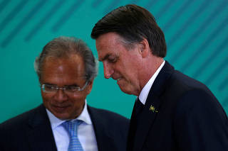 Brazil's President Bolsonaro and Economy Minister Guedes attend ceremony at Planalto Palace in Brasilia