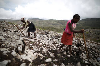 The Wider Image: Haitians abandon forgotten town, isolated for over a decade