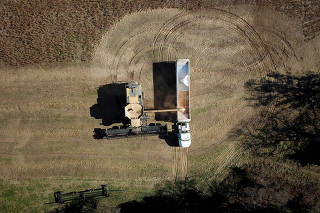 Farmer Lucas Richard of LFR Grain harvests a crop of soybeans at a farm in Hickory