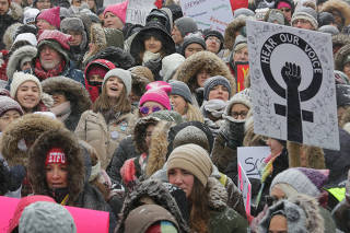 Participants listen to speakers outside City Hall during the Women's March in Toronto