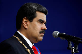 FILE PHOTO: Venezuelan President Nicolas Maduro attends a ceremony, after his swearing-in for a second presidential term, at Fuerte Tiuna military base in Caracas