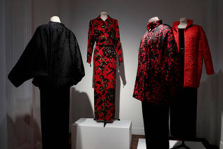 FILE PHOTO: Dresses from Catherine Deneuve's wardrobe and designed by French designer Yves Saint Laurent are displayed in the showroom of Christie's auction house before the collection sale in Paris