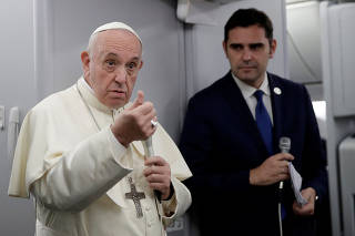 Pope Francis speaks during a news conference aboard a plane on the way back from Panama to Rome