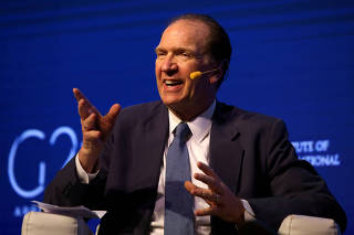 FILE PHOTO: David Malpass, Under Secretary for International Affairs at the U.S. Department of the Treasury, gestures during the 2018 G20 Conference in Buenos Aires
