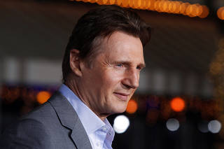 FILE PHOTO: Irish actor Neeson poses at the premiere of his film 