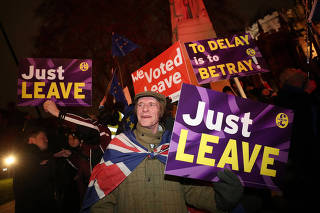 Pro-Brexit demonstrators protest outside the Houses of Parliament, in Westminster, London