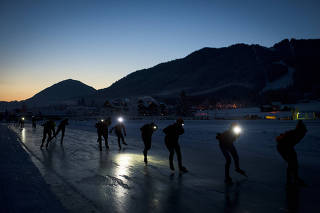Skaters wearing head lamps set out on the first lap of the Alternative Elfstedentocht, a 200-kilometer race, in Weissensee, Austria.