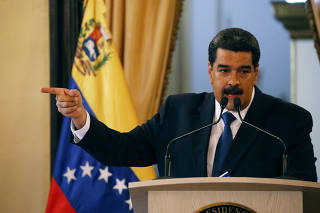 Venezuela's President Nicolas Maduro gestures during a news conference at Miraflores Palace in Caracas