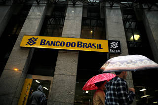 FILE PHOTO - People walk past a Banco do Brasil branch in downtown Rio de Janeiro