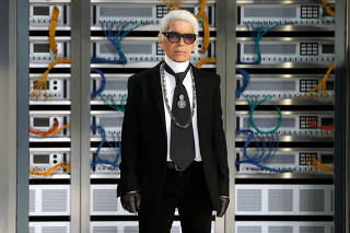 FILE PHOTO -  German designer Karl Lagerfeld appears at the end of his Spring/Summer 2017 women's ready-to-wear collection for fashion house Chanel during Fashion Week in Paris