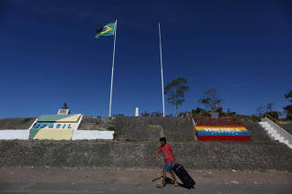 A man walks at the border with Venezuela, seen from in Pacaraima