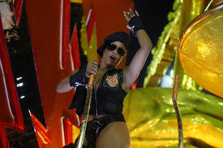 Reveller from Salgueiro samba school performs during the first night of the Carnival parade in Rio de Janeiro