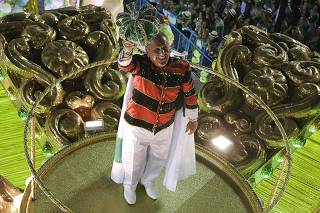 Brazilian soccer legend Zico stands atop a float in the annual Carnival parade in Rio de Janeiro's Samabadrome