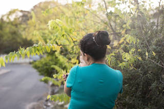 Cindy holds her son, Adonai, whom she said was born of rape by a smuggler while she crossed the border.