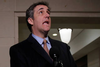 Former Trump personal attorney Cohen departs after House Intelligence Committee hearing on Capitol Hill in Washington