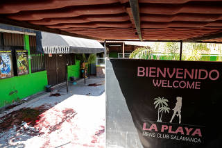 A general view shows the site of a crime scene at La Playa Men's Club where at least 13 people were killed and another seven wounded in a shooting at a bar early on Saturday in the city of Salamanca