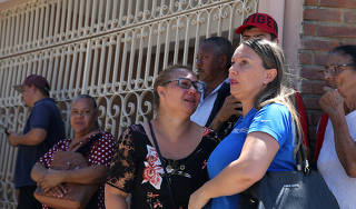 Relatives are seen in front of the Raul Brasil school after a shooting in Suzano