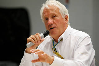 FILE PHOTO: FIA Formula One Race Director Charlie Whiting speaks during a press briefing at the Sochi Autodrom circuit