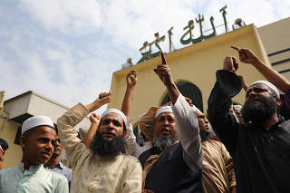 Muslims shout slogans as they condemn the Christchurch mosque attack in New Zealand, after Friday prayers at the Baitul Mukarram National Mosque in Dhaka