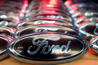 FILE PHOTO: Ford logos are seen at the assembly line of the Ford car factory of Saarlouis, Germany