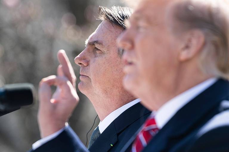 Brazil's President Jair Bolsonaro listens while US President Donald Trump speaks during a press conference in the Rose Garden of the White House March 19, 2019 in Washington, DC. (Photo by Brendan Smialowski / AFP)