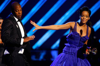 FILE PHOTO: Rihanna and Jay-Z react on stage after winning Grammy for best rap/sung collaboration for 