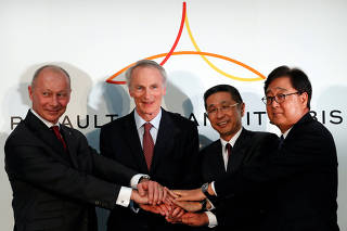 Renault, Nissan and Mitsubishi chiefs attend a joint news conference in Yokohama