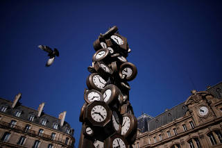 A view shows the clocks of the artwork 