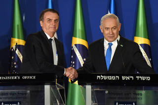 Israeli Prime Minister Benjamin Netanyahu and Brazilian President Jair Bolsonaro shake hands after they deliver joint statements in Jerusalem
