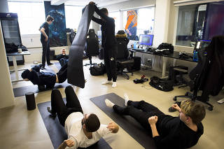 Team Origen stretches in their training room following a scrimmage against another team at RFRSH Entertainment's offices in Copenhagen, Denmark