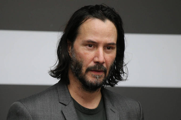 Keanu Reeves ao chegar para reunião com o governador João Dória