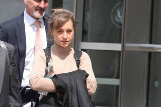 Actress Allison Mack departs the Brooklyn Federal Courthouse after facing charges regarding sex trafficking and racketeering related to the Nxivm cult case in New York